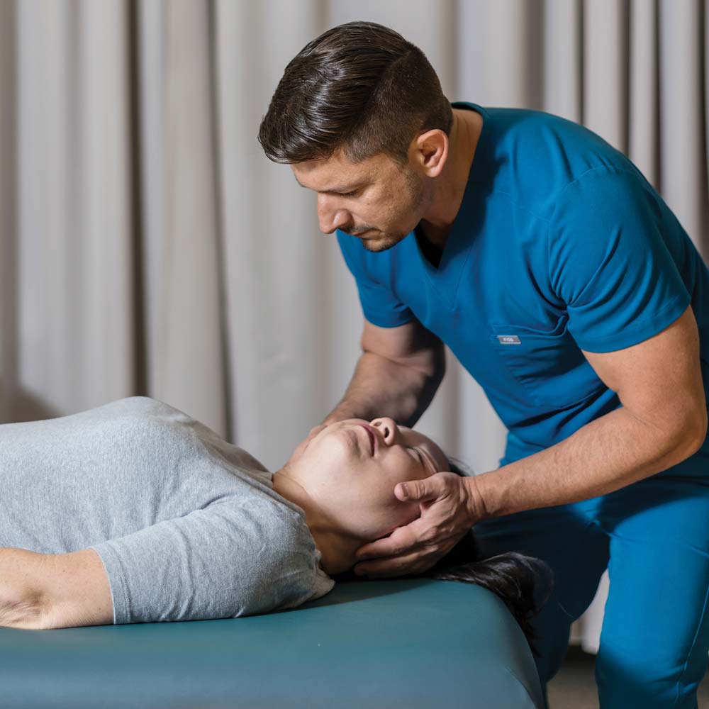 doctor and patient at chiropractic pt partnership spine and rehab